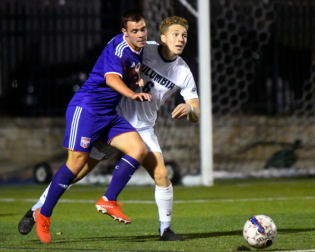 Columbia College senior Charles Norman, right, grapples with Missouri Valley junior Aleksandar Trujic